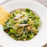 Little Gem Caesar · 450 cal. little gem lettuce, garlic croutons, parmesan cheese crisp, white anchovy, caesar d...