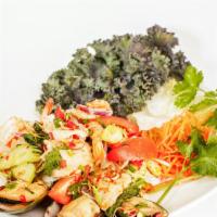 Yum Talay (Seafood Salad) · Mild spicy. A mix of shrimp, mussel, calamari, and fish in a mild chili lime dressing.