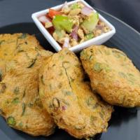 Fish Cake · Fish cakes with spices, sting bean, kaffir lime leaves, served with cucumber sauce.