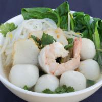 Fish Ball Noodle Soup · Flat noodle soup with fish balls, chicken, shrimp, fish cake, vegetables, green onions and c...