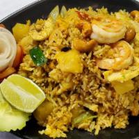 Pineapple Fried Rice · Jasmine rice pan-fried With egg, yellow curry powder, shrimp, chicken, pineapple chunk, cash...