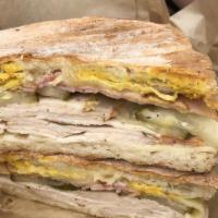 Cuban · Black forest ham ,natural baked turkey, Swiss cheese, pickles, grain mustard on tuscan ciaba...