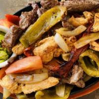 Fajita Supreme · steak, chicken & shrimp with bell peppers, onion and tomatoes