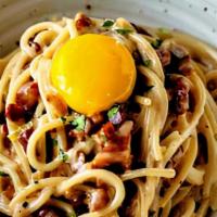 Spaghetti Carbonara · Pancetta, parmesan, egg yolk, garlic, and cream sauce.
