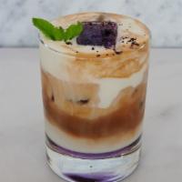 Lavender Latte - Iced Only · Espresso, lavender base, lavender ice cube, milk. - Iced Only
