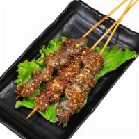 Chicken Heart Kebab · Chicken heart kebab with spicy cumin sauce on the top. One kebab each order.