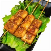 Fish Tofu Kebab · Fried fish tofu with spicy cumin sauce on the top. One kebab each order.