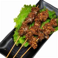 Chicken Gizzard Kebab · Chicken gizzard kebab with spicy cumin sauce on the top. One kebab each order.
