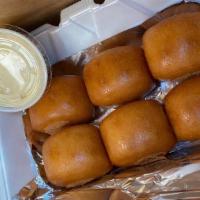 Fried Breads With Condensed Milk · Fried 6pcs of breads with condensed milk on the side.