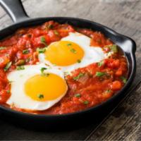 Huevos Con Chorizo · Two farm fresh eggs scrambled with flavorful chorizo. Served with your choice of beans, rice...