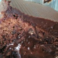Triple Chocolate Fudge Brownie · It's huge, has a soft center & topped with ganache.