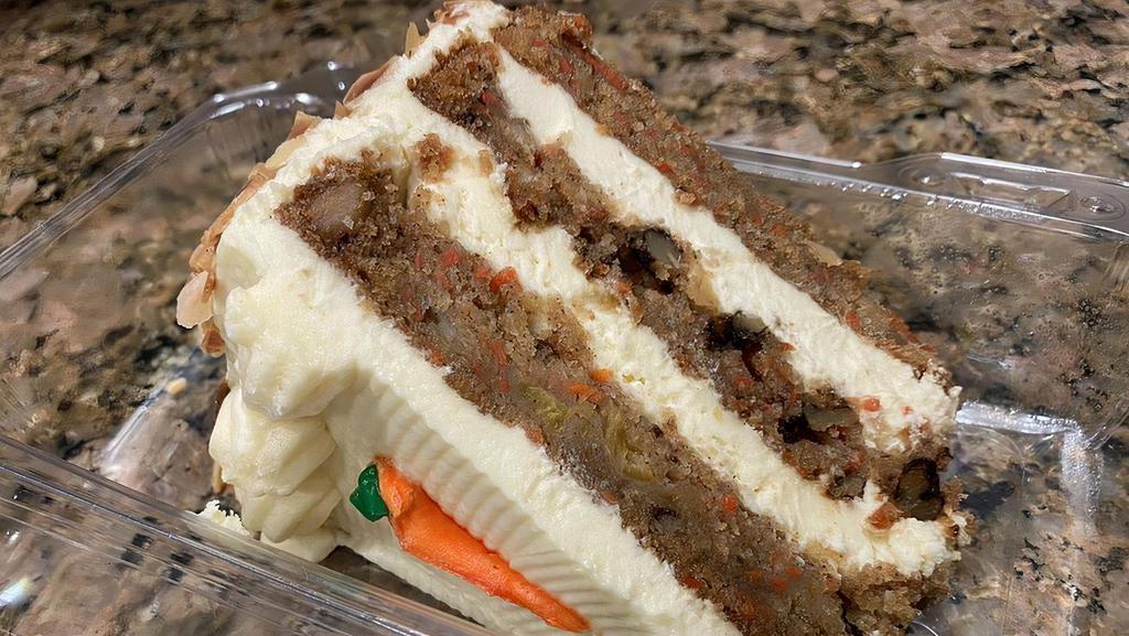 Carrot Cake · 3-layer sliced cake with cream cheese frosting.