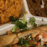 Taquitos Plate · 4 Taquitos, Rice & Beans.
Our 'beef' taquitos are topped with chopped tomato & onion, cilant...