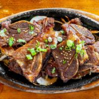 La Galbi · Marinated beef short rib with bone (12 pieces).
(Served with one white rice and Korean tradi...