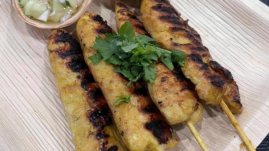 Chicken Satay 4Pcs · Chicken tenders marinated in coconut milk  and different spices  grilled on bamboo skewers. Served with peanut sauce and cucumber sauce.