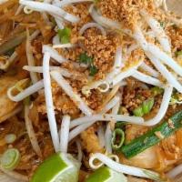 Pad Thai · Rice noodles, eggs, bean sprouts, green onions garnished with crushed peanuts.