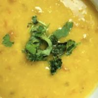 Vegan Yellow Lentil Soup · Yellow lentil or Daal cooked with crushed ginger and roasted garlic with onions and tomatoes...
