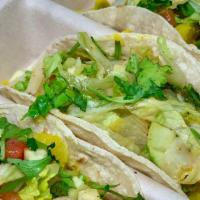 Potato Tacos · 3 tacos on your choice of corn or flour tortillas filled with baked turmeric potatoes on a b...