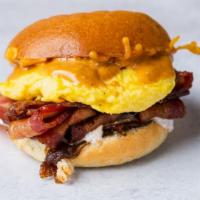 Birdies Breakfast Sandwich With Eggs And Bacon · Over easy or scrambled egg with Applewood smoked bacon and cheddar with Birdies special sauce.