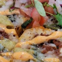 Chorizo · house-made chorizo, grilled chile guero, fire roasted poblanos, cream cheese topped with roa...