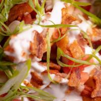 Loaded Wedges · Potato wedges with sharp cheddar, green onions, sour cream, bacon & tomato.