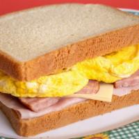 Ham, Sausage, Eggs & Cheese Toast · Ham, sausage, egg and cheese. Choice of white bread or wheat bread.