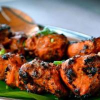 Chicken Tikka · Tender pieces of chicken cooked in tandoor, marinated in yogurt, and special blend of spices.