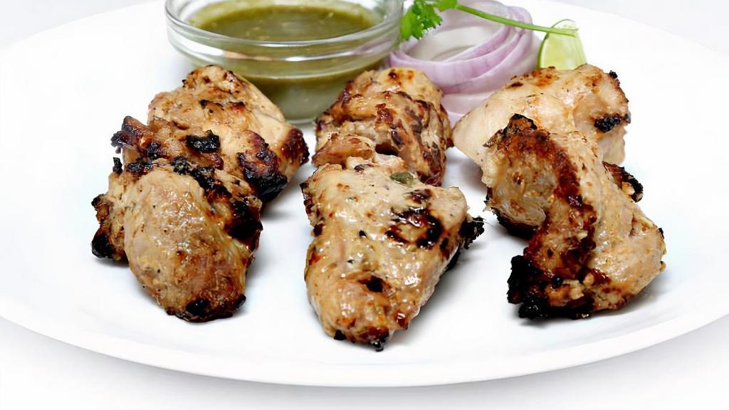 Murgh Malai Kebab (Malai Chicken Kebab) · Boneless Chicken breast marinated in chef's special blend of spices for several hours and cooked in tandoor to perfection.