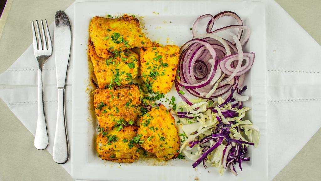Amritsari Fish Tikka · IKP specialty dish. White fish cubes marinated in tandoori masala and crushed garlic cooked in tandoor.