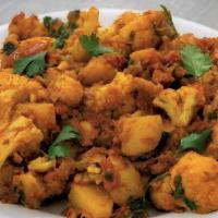 Gobi Aloo · Potato and cauliflower cooked in slow fire with cumin seeds, coriander, and green chilies.