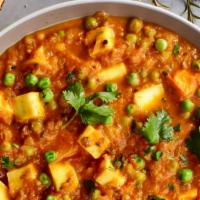 Matar Paneer · Paneer tossed with garden peas, and then cooked with a curry of mild spices.