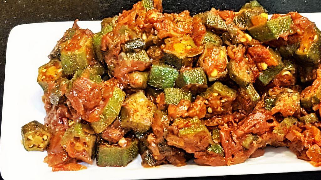 Bhindi Do Pyaza (Okra) · Fresh okra cooked with flavored spices, tossed with diced onion and ginger.