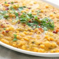 Daal Tadka · Yellow daal cooked in slow fire with fresh onion and tomatoes tempered with cumin seeds and ...