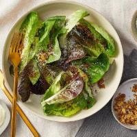 Little Gem Caesar Salad · Gem lettuce, GF Sourdough herby crushed croutons, and a side of nondairy Caesar dressing (sh...