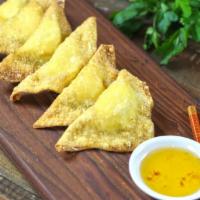Crab Wontons · Crispy wontons stuffed with cream cheese and crab meat. Served with sweet plum dipping sauce.
