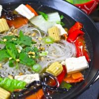 Veggie Soup · Silver noodles, steamed tofu and a large helping of seasonal vegetables boiled in a vegan br...