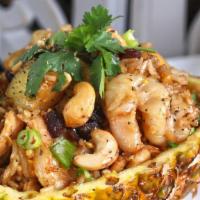 Chicken & Shrimp Pineapple Fried Rice · Fried rice with chicken, prawns, egg, pineapple, cashews, raisins, cilantro, onion and tomat...