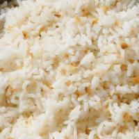 Garlic Rice · White rice with fried garlic and oil.