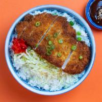 Chicken Katsu Bowl · Fried chicken cutlet over white rice with onion slices and egg topped with green onion, red ...