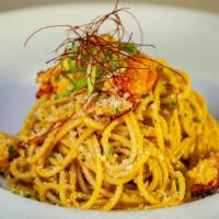 Lobster Pasta · Linguine pasta with whole live lobster, French beans, tomatoes scallion in lobster cream sau...