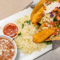 Fish Tacos · Two seven inch corn or flour tortillas filled with grilled or crispy white fish, shredded ca...