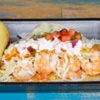 Grilled Baja Taco · Fish and shrimp on a flour tortilla topped with cabbage, pico de gallo, salsa, and cream. (g...