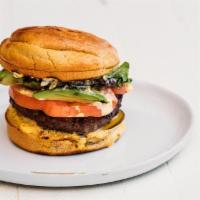 Bison Burger  · Wild bison patty, tomato confit, caramelized onion, bibb lettuce, spicy aioli, paleo bun