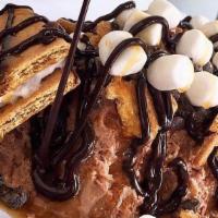 S'Mores · Chocolate snow, graham crackers, marshmallows, chocolate chips and chocolate syrup.