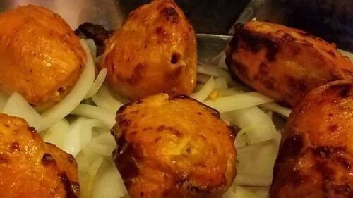 Chicken Tikka · Boneless chicken breast marinated in spices, tandoor grilled.