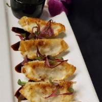 Gyoza · Chicken dumplings (6), pan seared with a spicy ponzu dipping sauce