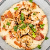 Southern Shrimp & Grits  · Seared shrimp with a sprinkling of cayenne and paprika, served over creamy, stone ground grits