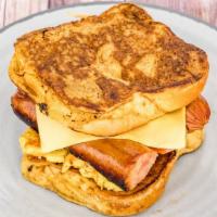 French Toast Sandwich · Two eggs, melted cheese, and bacon served between two slices of french toast.
