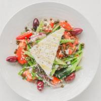Village Salad Horiatiki. · Tomato, cucumber, feta, kalamata olive, red onion, bell pepper, caper, extra virgin olive oi...