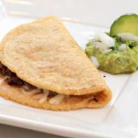 Asada Quesadilla · grilled steak. Handmade to order on 100% gluten free corn tortillas and served with guacamol...